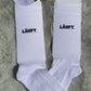 Nachhaltige Tennissocke aus Bio-Baumwolle mit „läuft“-Design auf dem Schaft